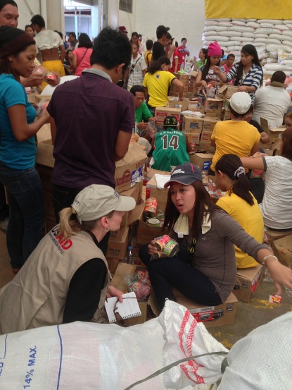 Volunteers sorting and repacking emergency supplies at the Tacloban Task Force Logistics headquarters Nov. 19, 2013 Image courtesy of USAID [http://www.usaid.gov/philippines]/US Embassy-Manila [http://manila.usembassy.gov/] via Flickr [http://www.flickr.com/photos/usembassymanila/10935591704/]